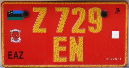 Tourist Taxi using yellow on red pressed plates.